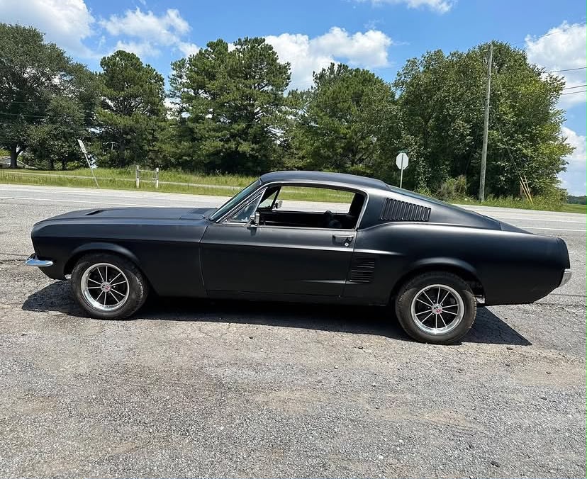 Matte Black Driving 1967 Ford Mustang Fastback for sale